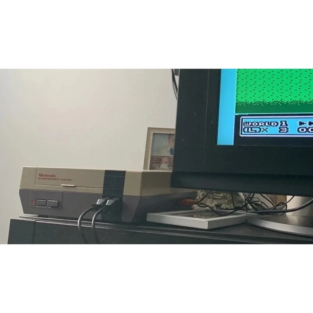 authentic NES Console Bundle with Super Mario Bros. 1,2,3 and 2 Controllers gun